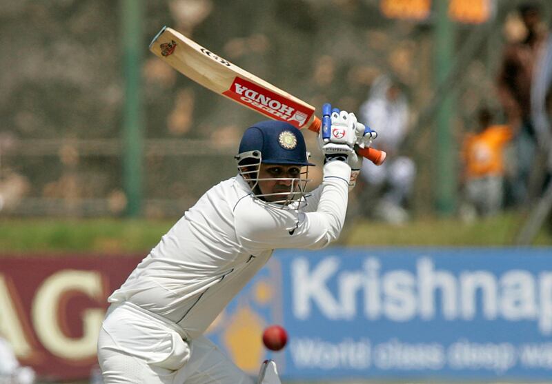India's Virender Sehwag  plays a shot against Sri Lanka during their second test cricket match in Galle, August 2, 2008. REUTERS/Anuruddha Lokuhapuarachchi (SRI LANKA)