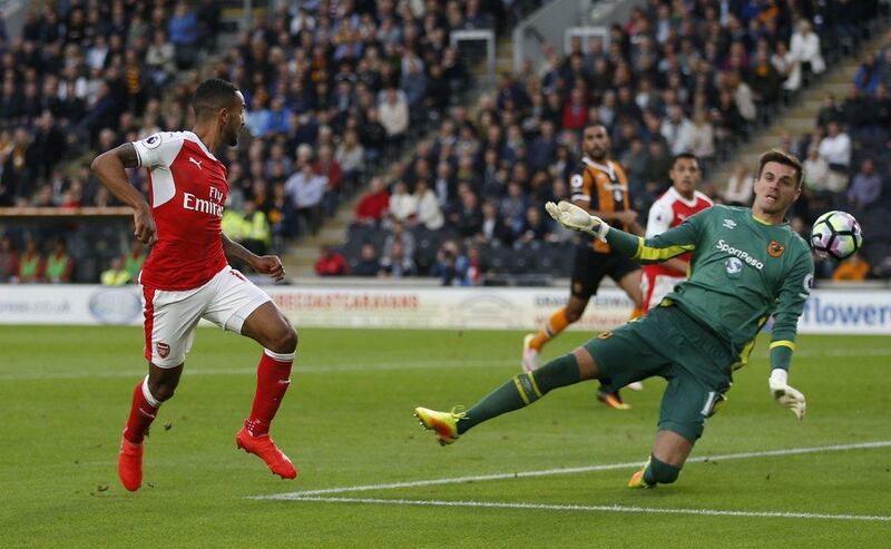 Arsenal’s Theo Walcott scores their second goal. Russell Cheyne / Reuters