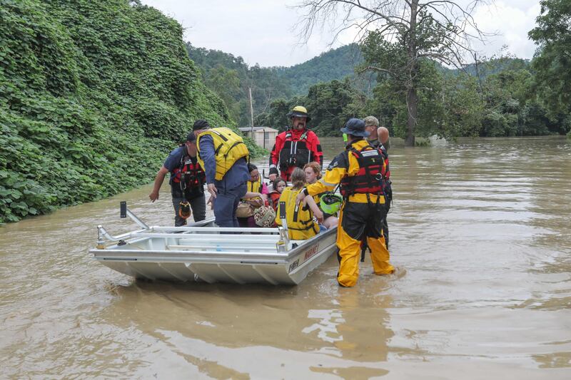 A group of stranded people are rescued from the floodwaters. AFP