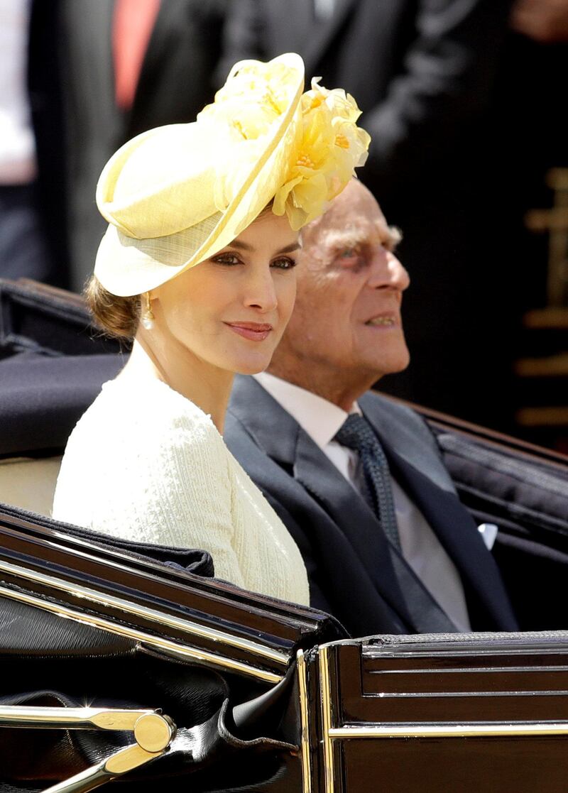 Prince Philip rides in a carriage with Queen Letizia, following their ceremonial welcome and parade in central London. Matt Dunham