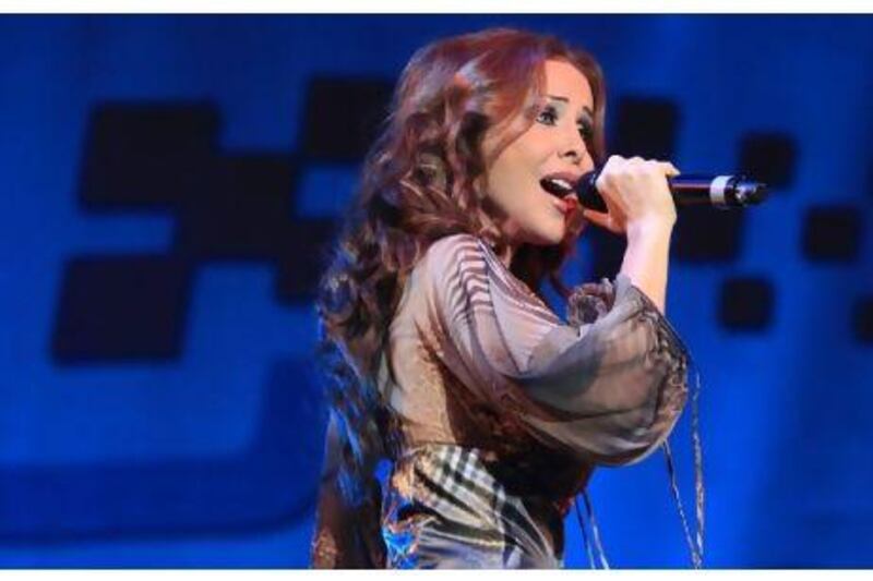 The Lebanese singer Rola Saad belts out a tune last night on the Abu Dhabi Corniche.