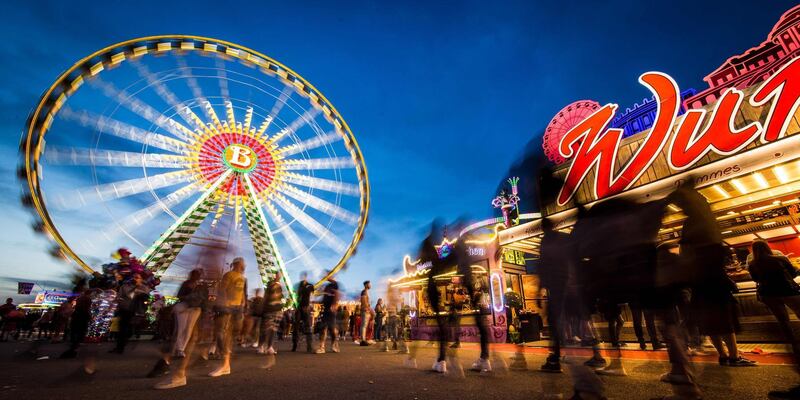 Visitors enjoy the 81st Stuttgart Spring Festival at the Cannstatter Wasen at the blue hour in Stuttagrt, southern Germany.  AFP