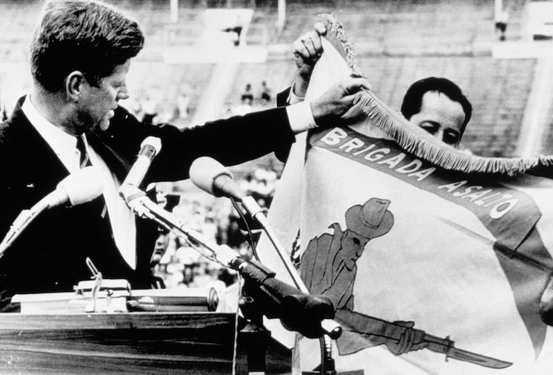 US president John F Kennedy in 1961 with the combat flag of a Cuban landing brigade before the failed Bay of Pigs invasion. The Soviet leader, Nikita Khrushchev, laid the blame for American support of Cuban anti-Communists not with the president but with the country’s treasury secretary, a book on Soviet intelligence finds. Corbis