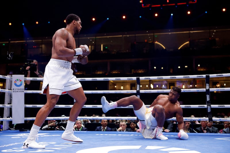 Anthony Joshua sends Francis Ngannou to the canvas during their heavyweight bout in Riyadh, Saudi Arabia. Reuters