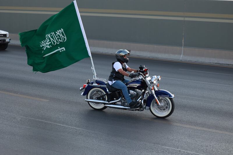 This motorcyclist's flag is as big as his bike.