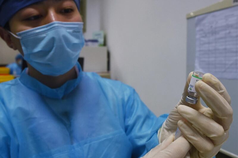 A medical staff member prepares to administer a dose of the China National Biotec Group Covid-19 coronavirus vaccine at a hospital in Hangzhou in China's eastern Zhejiang province. AFP