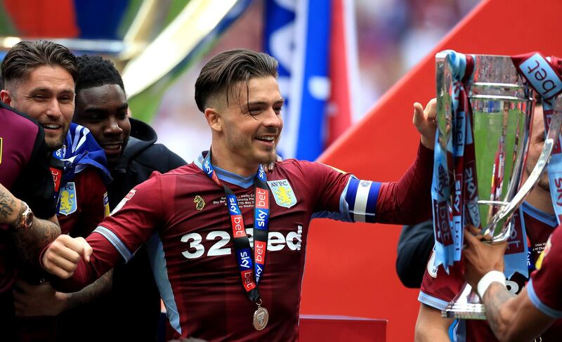 Jack Grealish celebrates with the trophy after winning the Sky Bet Championship Play-off final at Wembley Stadium. PA
