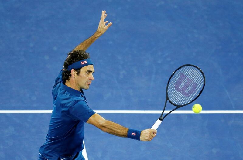 Federer volleys from the net. EPA