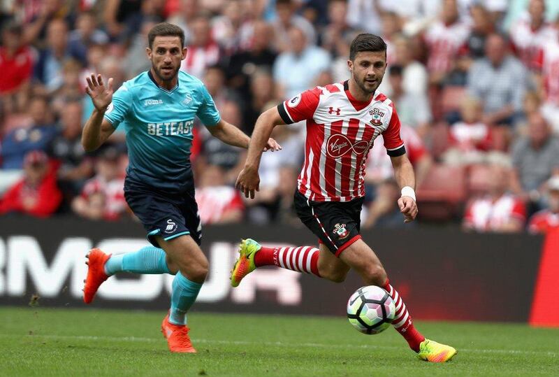 Shane Long of Southampton, right, in action during the Premier League match against Swansea City. Bryn Lennon / Getty Images