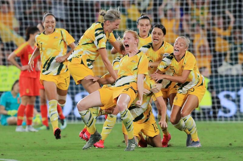 Austalia's Emily van Egmond celebrates her injury-time goal with teammates during the Olympic qualifier against China at Bankwest Stadium in Sydney, on Thursday, February 13. The matched finished 1-1. Getty
