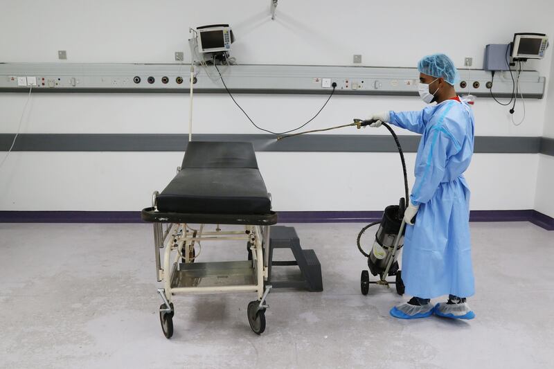 A worker disinfects a room where patients undergo tests for the coronavirus disease (COVID-19), at Rafik Hariri University Hospital in Beirut, Lebanon October 1, 2020. Picture taken October 1, 2020. REUTERS/Issam Abdallah