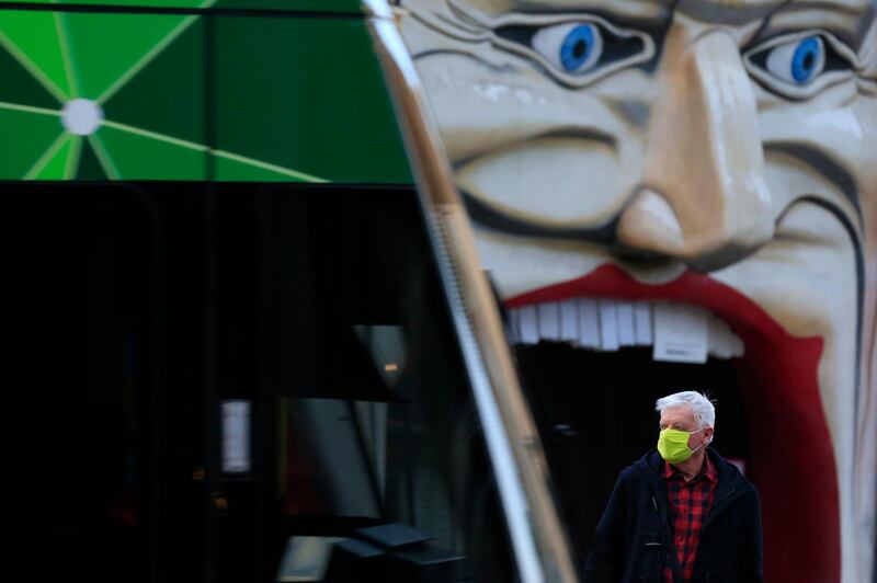 A man catching a tram in St Kilda wears a face mask in Melbourne, Australia. Getty Images