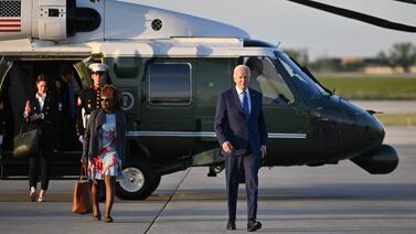 US President Joe Biden (R) and White House Press Secretary Karine Jean-Pierre (C) make their way to board Air Force One before departing Chicago O�Hare International Airport in Chicago, Illinois on May 8, 2024. Biden was in Chicago to attend a campaign event. (Photo by Mandel NGAN / AFP)