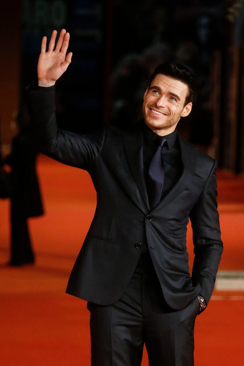 Richard Madden waves to fans. EPA