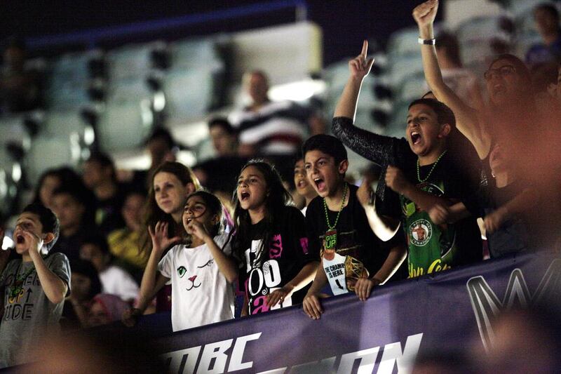 Fans cheer for John Cena during WWE Live at Zayed Sports City in Abu Dhabi. Christopher Pike / The National