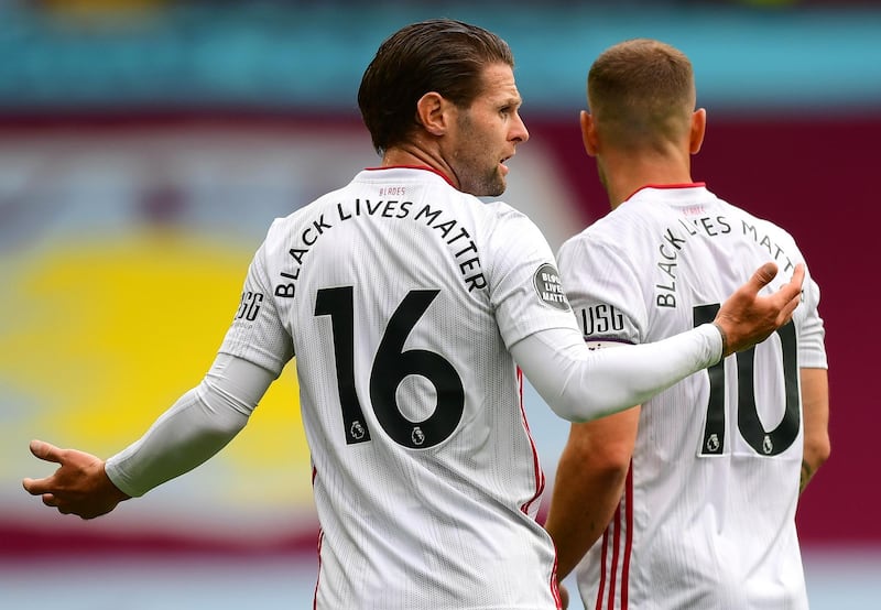 'Black Lives Matter' writing is seen on the back of Ollie Norwood and Billy Sharp's jerseys. Getty