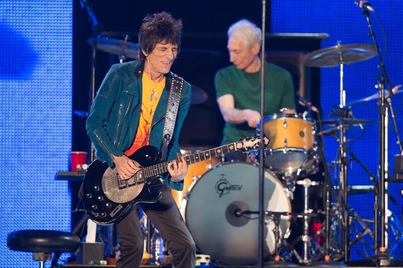 The Rolling Stones's Ronnie Wood on the guitar and Charlie Watts on drums, at du Arena, Yas Island on February 21, 2014 . Getty Images