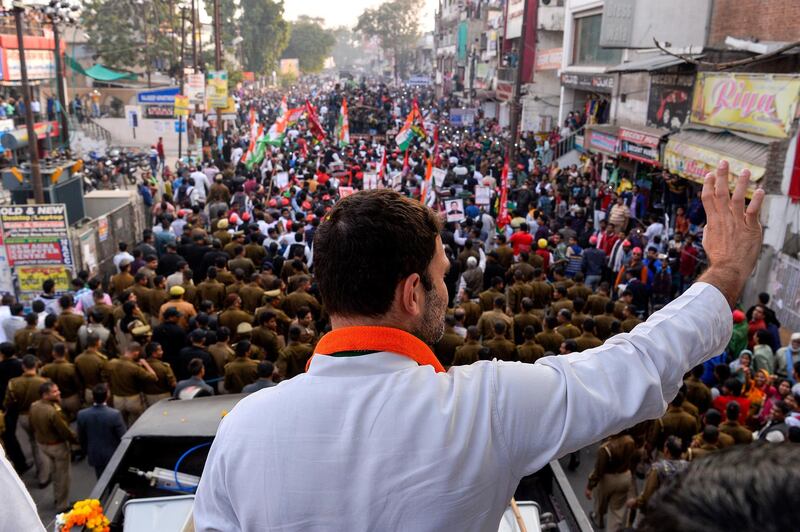 Congress party Vice President Rahul Gandhi waves to the crowd during a joint election rally with the Uttar Pradesh state chief minister in Agra on February 3, 2017. - Elections in northern Uttar Pradesh begin on February 11, voting is divided into seven phases. Results from all the elections will be declared on 11 March. (Photo by CHANDAN KHANNA / AFP)