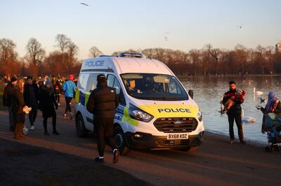 A police van is seen as people visit Kensington Palace Gardens, amid the spread of the coronavirus disease (COVID-19), in London, Britain, January 9, 2021. REUTERS/Simon Dawson