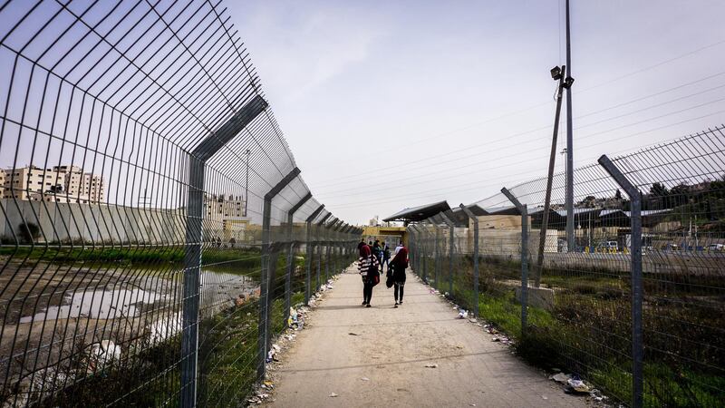 The fence leading to the checkpoint into Shuafat camp in Jerusalem. Jack Moore / The National