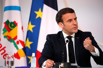 French President Emmanuel Macron delivers his speech after a meeting via video-conference with leaders of the G5 Sahel two-day summit in N'Djamena, at the Elysee Presidential Palace in Paris, on February 16, 2021. France will intensify its efforts to help "decapitate" Qaeda-linked groups in the Sahel, President Emmanuel Macron told regional leaders via video conference. / AFP / POOL / Francois Mori
