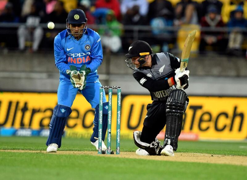 New Zealand's Tim Seifert, right, batting in front of India's MS Dhoni during the Twenty20 cricket international between New Zealand and India in Wellington, New Zealand, Wednesday, Feb. 6, 2019. (AP Photo/Ross Setford)