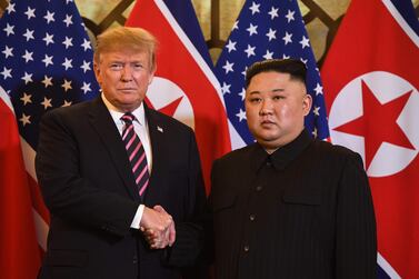 US President Donald Trump (L) shakes hands with North Korea's leader Kim Jong-un before a meeting at the Sofitel Legend Metropole hotel in Hanoi on February 27, 2019. AFP