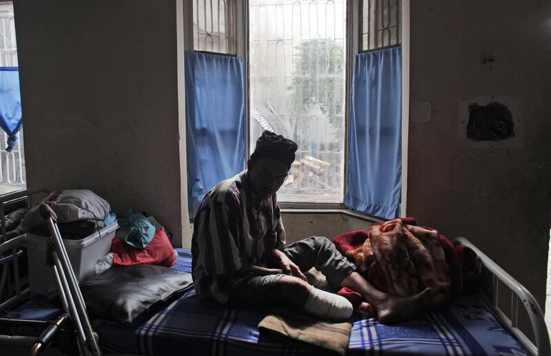 Bhishnu Bahadur Karki, 42, who lost his leg in the earthquake this year, rests at a rehabilitation centre in Kathmandu. Bhishnu was a construction worker before the quake. Niranjan Shrestha / AP Photo