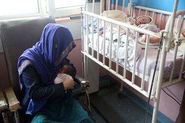 A mother breastfeeds her two-day-old baby at the Ataturk Children's Hospital a day after being rescued from another maternity hospital following a deadly attack in Kabul, Afghanistan. AP