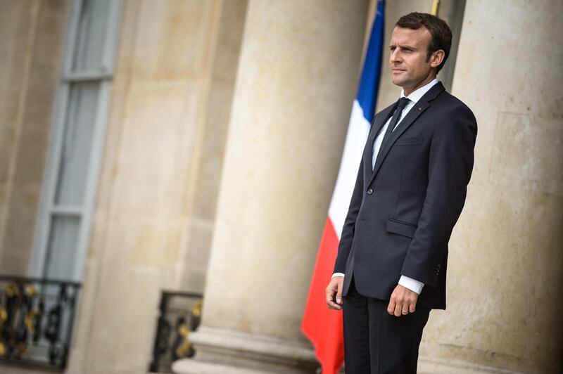 epa06174109 French President Emmanuel Macron stands in front of the Elysee palace after a meeting with Ivory Coast's President Alassane Ouattara (not pictured) in Paris, France, 31 August 2017. Ouattara is in Paris for a one-day working visit.  EPA/CHRISTOPHE PETIT TESSON