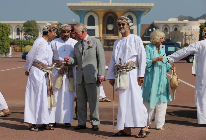 Sayyid Haitham bin Tariq Al Said, center right, is seen next to Britain's Prince Charles while welcoming him and his wife, Camilla, Duchess of Cornwall, at Bait Al Noor church in Muscat. AP Photo