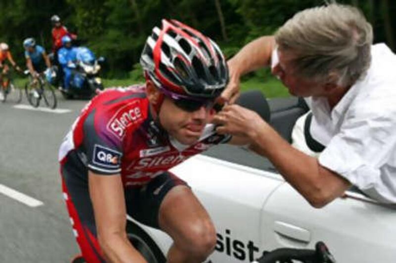 The Australian rider Cadel Evans receives treatment after crashing during yesterday's stage.