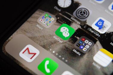 An icon of Chinese app WeChat is displayed among other apps on an iPhone, in Beijing. US President Donald Trump has issued an executive order to ban US transactions with Chinese companies Tencent and ByteDance. EPA