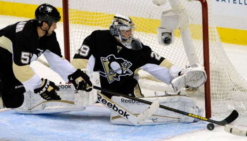 Marc-Andre Fleury, right, made 26 saves for the Pittsburgh Penguins. David DeNoma / Reuters