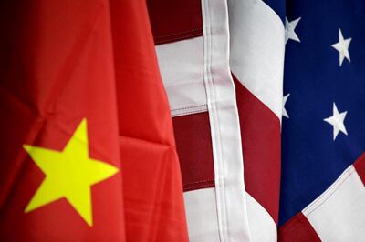 FILE PHOTO: Flags of U.S. and China are displayed at American International Chamber of Commerce (AICC)'s booth during China International Fair for Trade in Services in Beijing, China, May 28, 2019. REUTERS/Jason Lee/File Photo