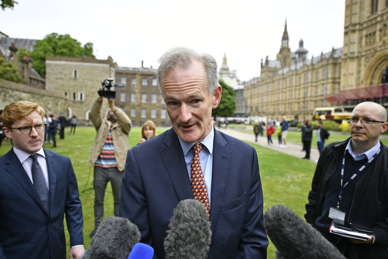 John Penrose, the prime minister's anti-corruption official who resigned, claiming it is 'pretty clear' that Boris Johnson broke the Ministerial Code, speaks to the media on College Green in central London. PA