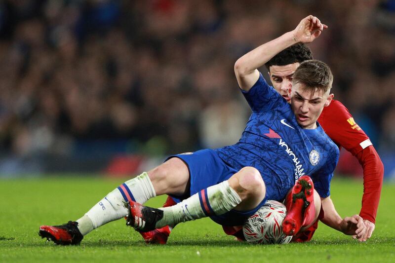 Billy Gilmour is tackled by Curtis Jones. AP Photo