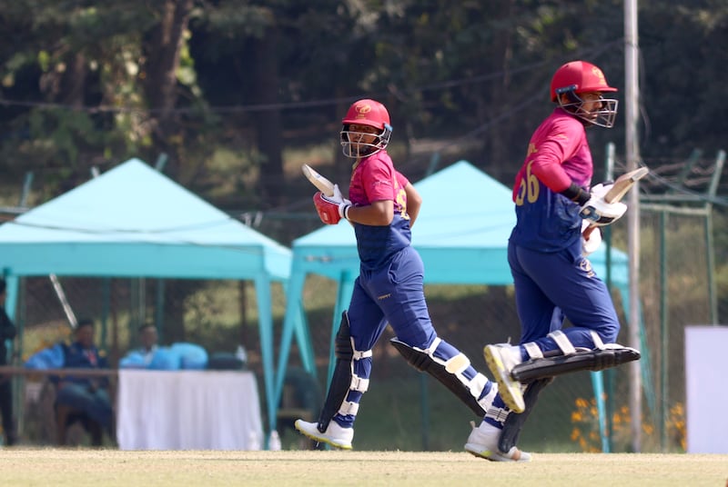 Ayaan Khan and Hazrat Bilal, right, run between the wickets against Nepal