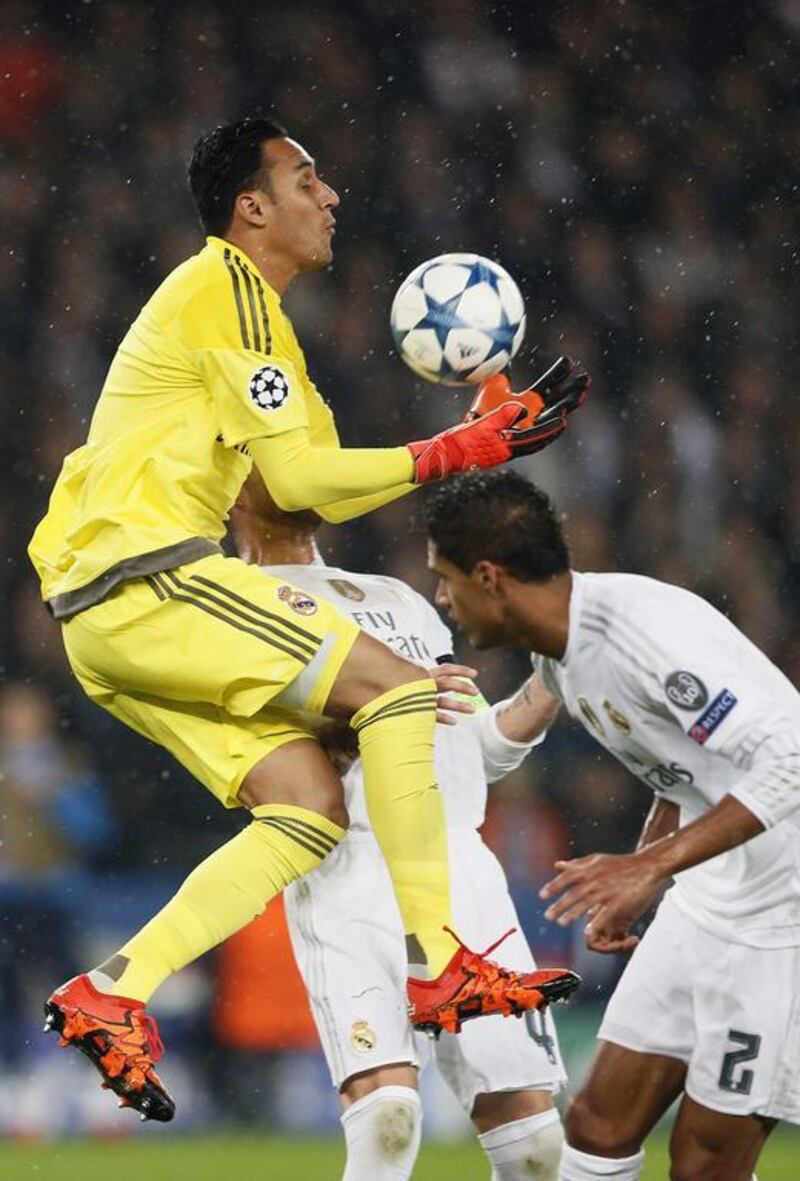 Real Madrid goalkeeper Keylor Navas collects the ball against PSG on Wednesday night in the Champions League. Ian Langsdon / EPA