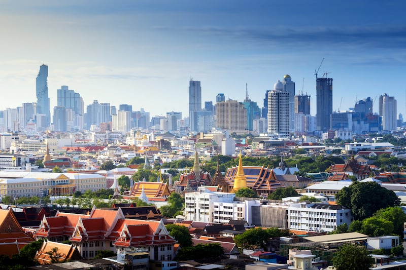 Grand palace and Wat phra keaw and Bangkok Cityscape, Business district with sunrise at bangkok ,Thailand. Temple of the Emerald Buddha. landscape of the capital city