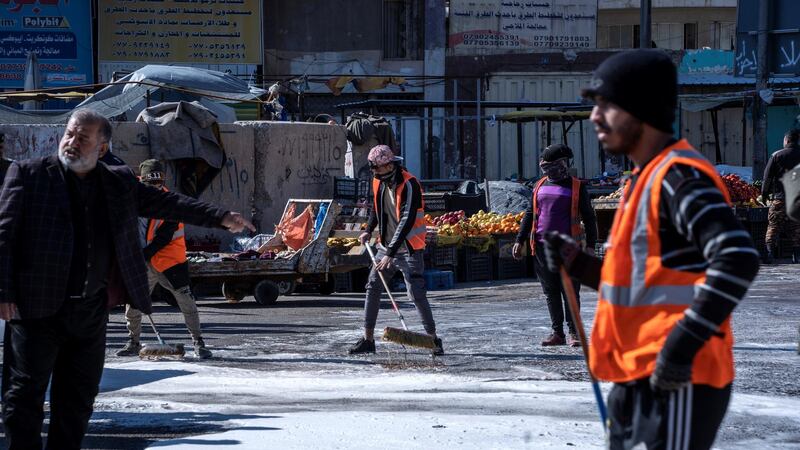 Clean up operations begin at the site of a suicide attack in a central market in Baghdad. Haider Husseini/ The National