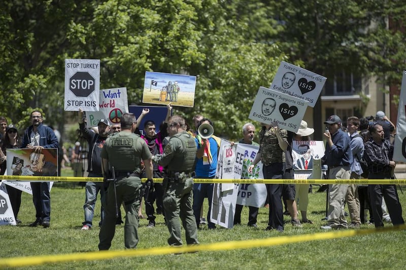 Opponents of Recep Tayyip Erdogan hold a rally in Lafayette Park. Later, Erdogan supporters and security guards clashed with Kurdish and Armenian protesters. Shawn Thew / EPA