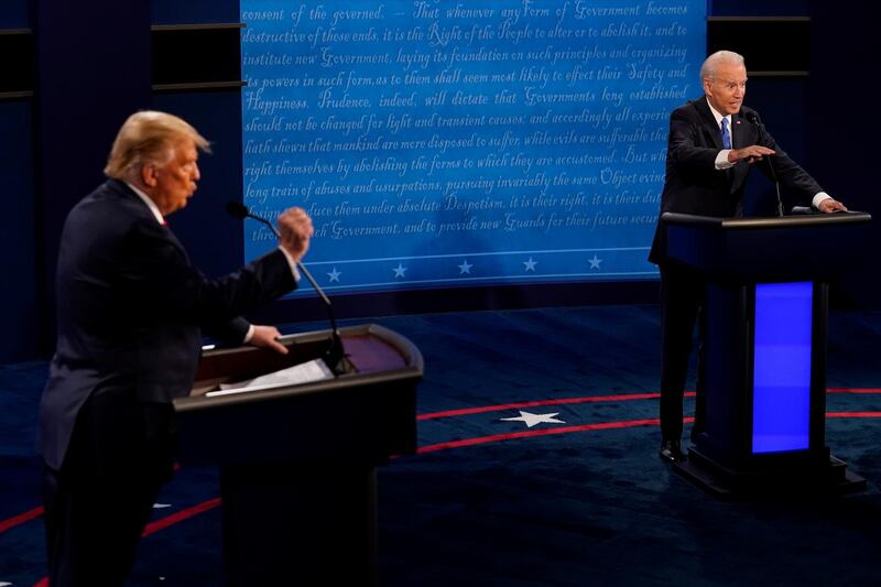 US President Donald Trump and Democratic presidential candidate Joe Biden respond to questions during the presidential debate. Reuters