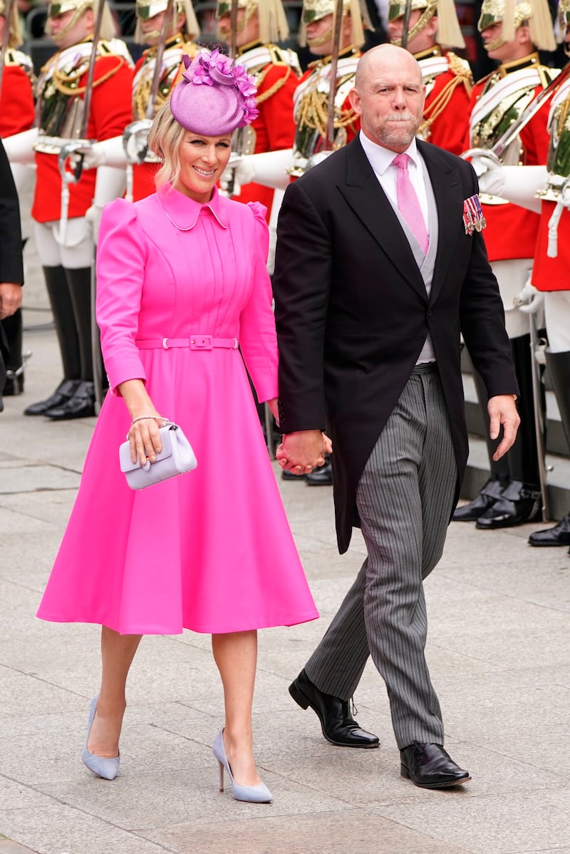 Zara Tindall, wearing a pink Laura Green London coat dress and co-ordinated hat, and Mike Tindall arrive for a service of Thanksgiving for the reign of Queen Elizabeth II at St Paul’s Cathedral on June 3, 2022. AP Photo