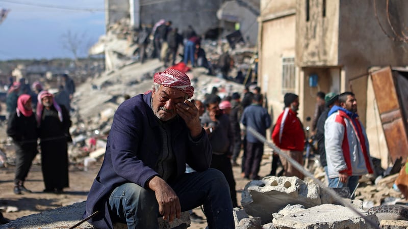 A Syrian man in despair as the level of the earthquake's destruction in Jindayris hits home. AFP
