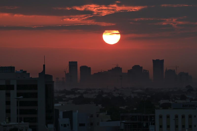 DUBAI, UAE. January 13 2014 - The morning sun turns the sky red as it rises over the horizon in Dubai, January 14, 2014.  (Photo by: Sarah Dea/The National, Story by: Standalone, FOCAL POINT)

