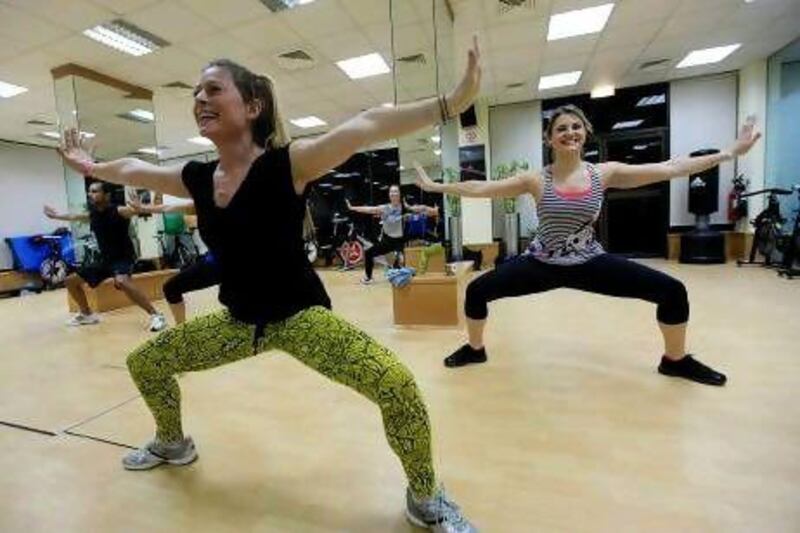 Yvette Franzos, left, leads an IntenSati class in Dubai. The workout includes reciting mantras. Satish Kumar / The National