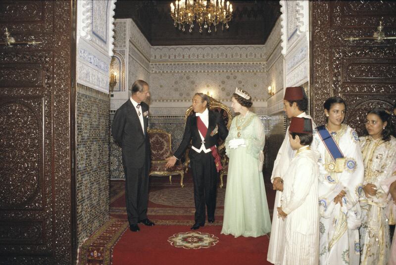 King Hassan II of Morocco (1929-1999) and his family with Queen Elizabeth II and Prince Philip at the royal palace in Rabat during a state visit to Morocco, 28 October 1980. (Photo by Tim Graham Photo Library via Getty Images)