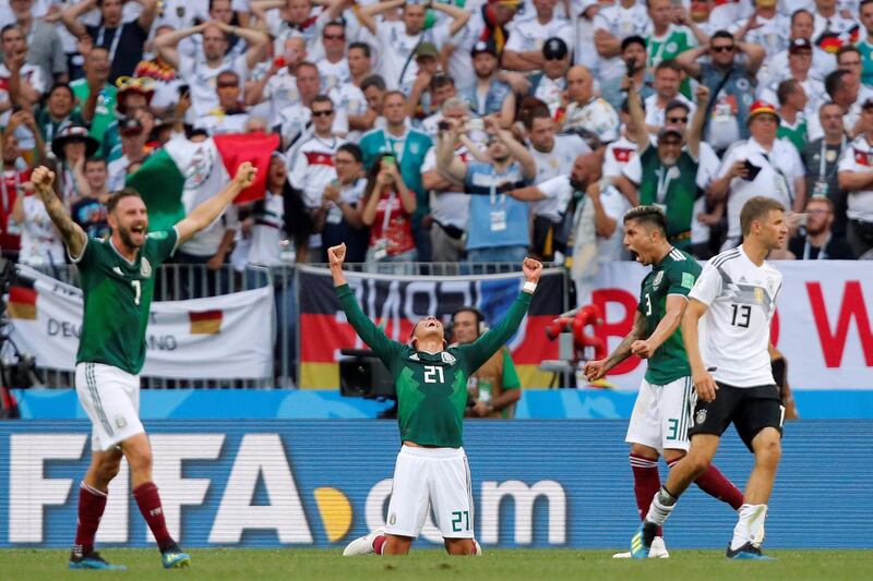 Soccer Football - World Cup - Group F - Germany vs Mexico - Luzhniki Stadium, Moscow, Russia - June 17, 2018   Mexico's Edson Alvarez, Miguel Layun and Carlos Salcedo celebrate at full time as Germany's Thomas Muller looks dejected    REUTERS/Maxim Shemetov