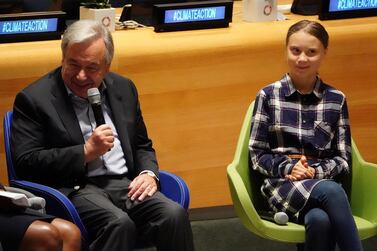 UN Secretary General Antonio Guterres speaks beside environmental activist Greta Thunberg at the Youth Climate Summit at the UN Headquarters on September 21, 2019. Reuters